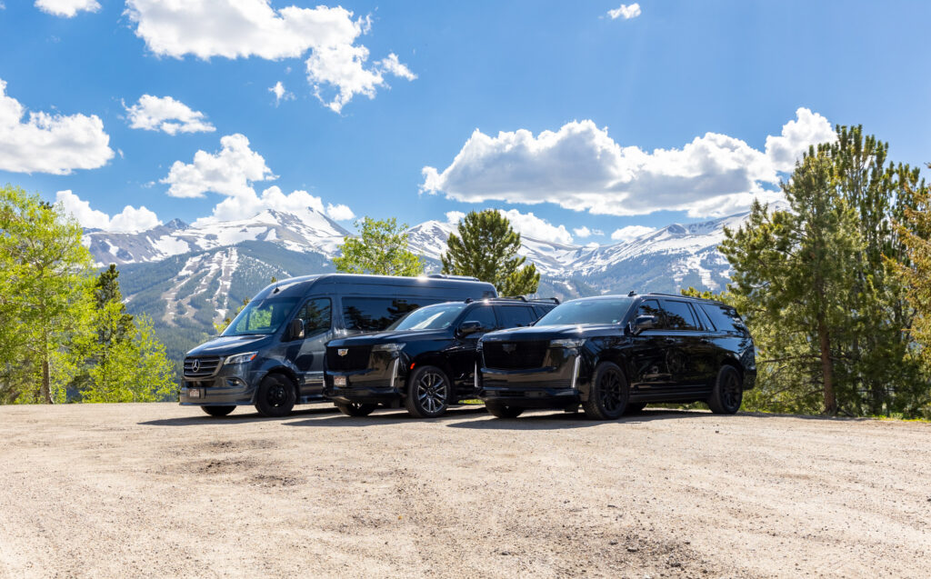 Summit Black Car fleet staged — Cadillac Escalade, Suburban, and Sprinter lineup